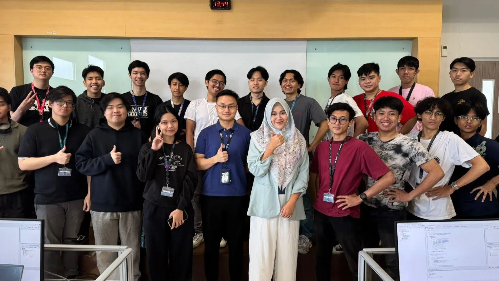 Group photo of Matthew, lecturer, and students during a collaborative class