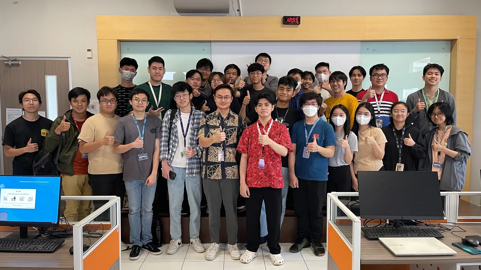 Group photo of Matthew and students from a programming class