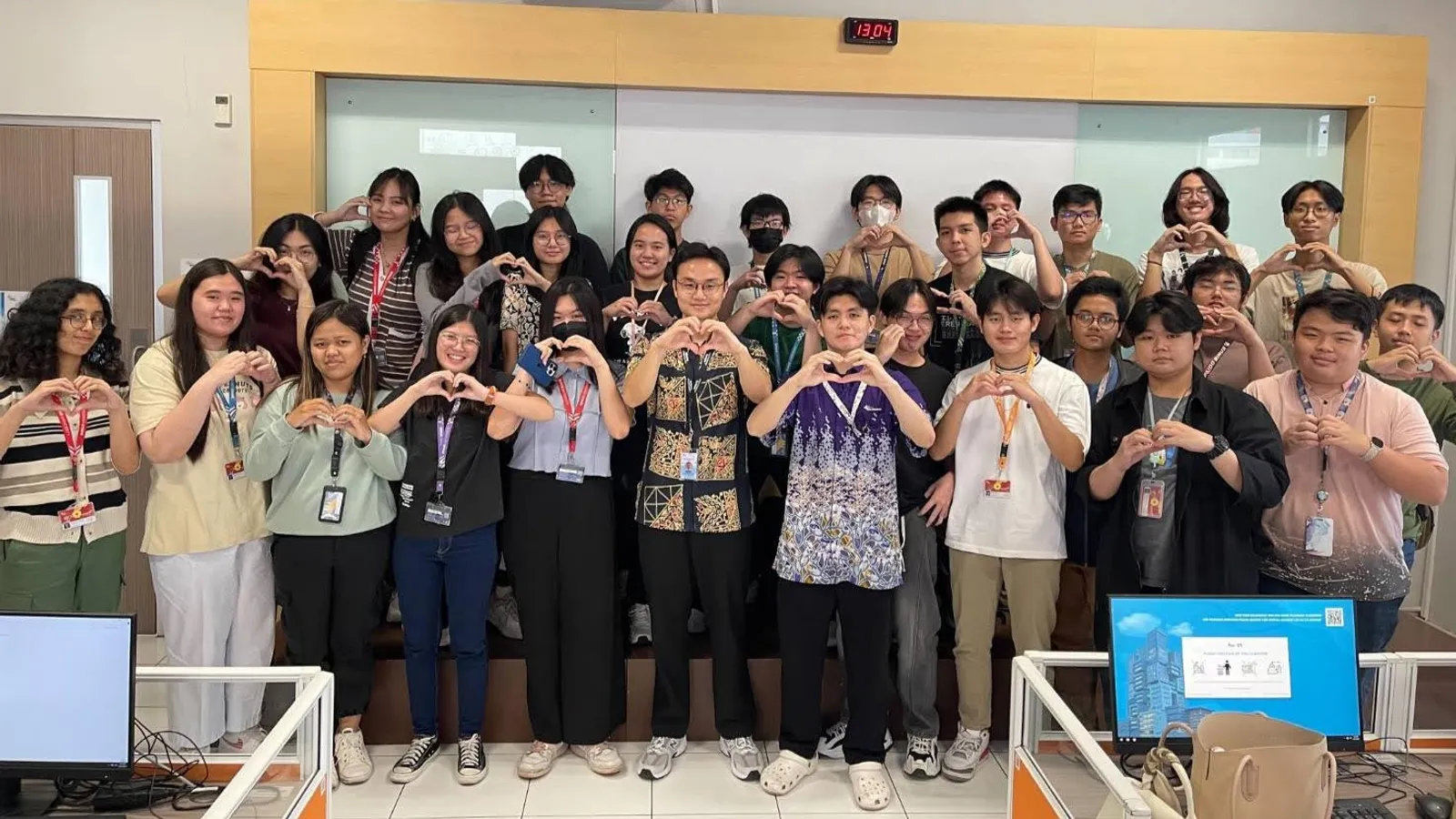 Group photo of Matthew and students from a programming class